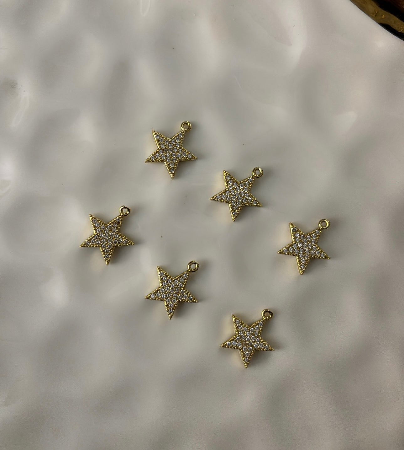 Filled star charms