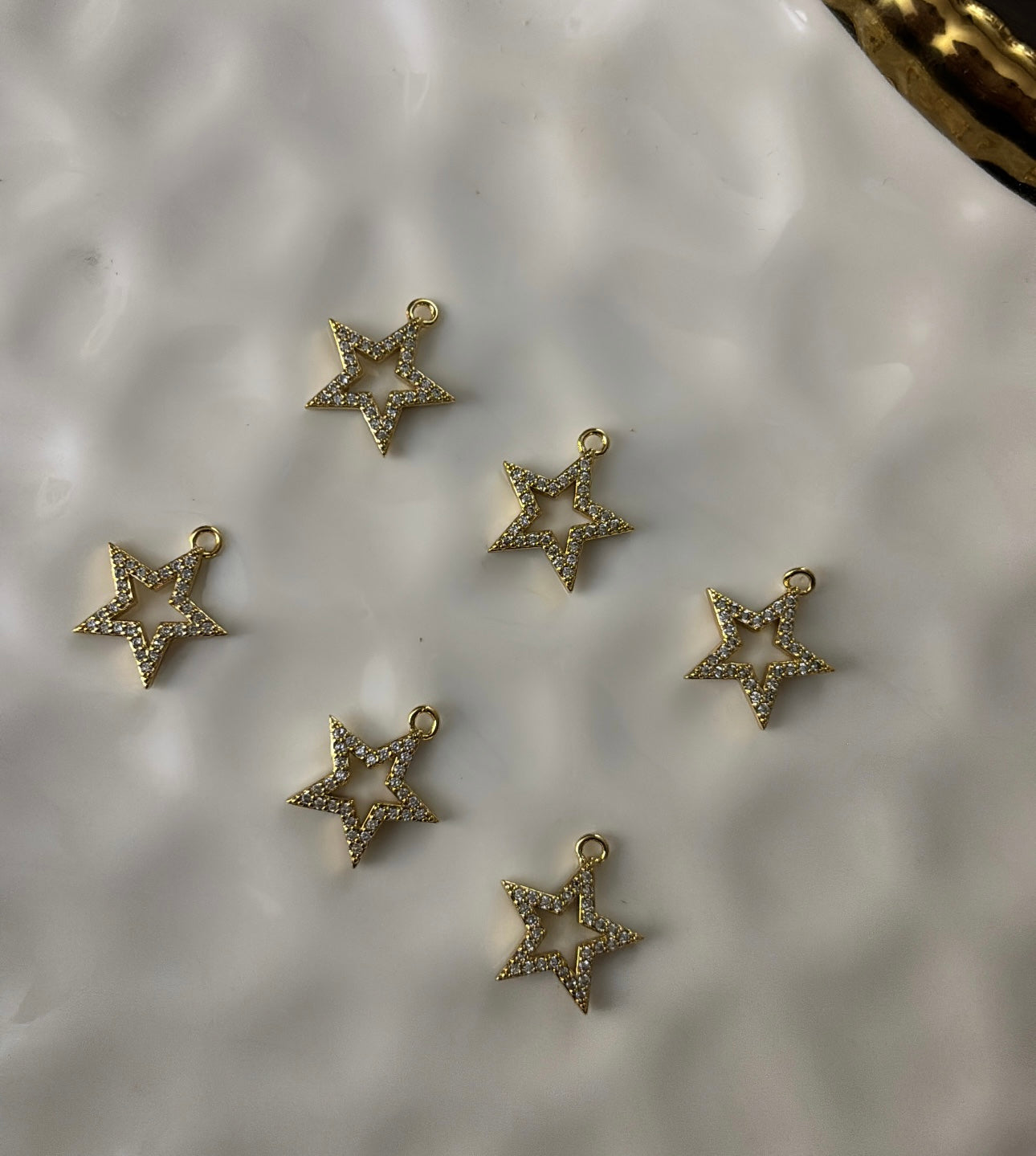 Outlined star charms